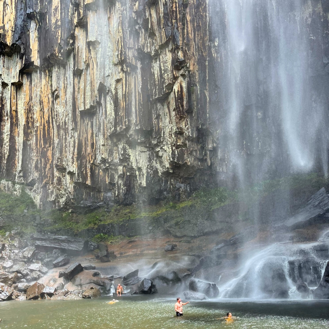 People swimming at the bottom of the Minion Falls in New South Wales