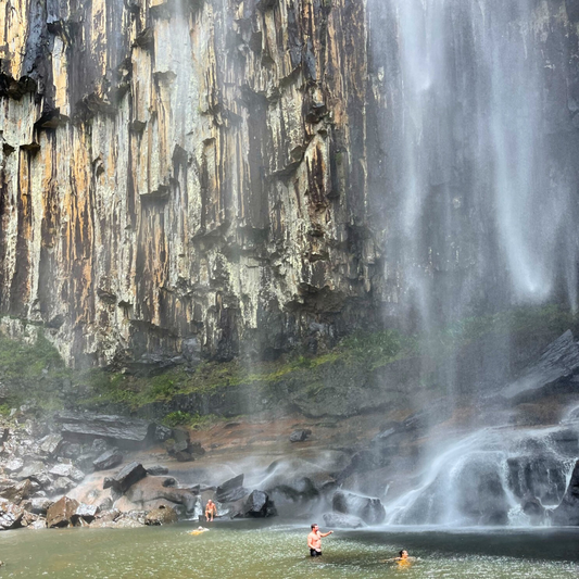 People swimming at the bottom of the Minion Falls in New South Wales