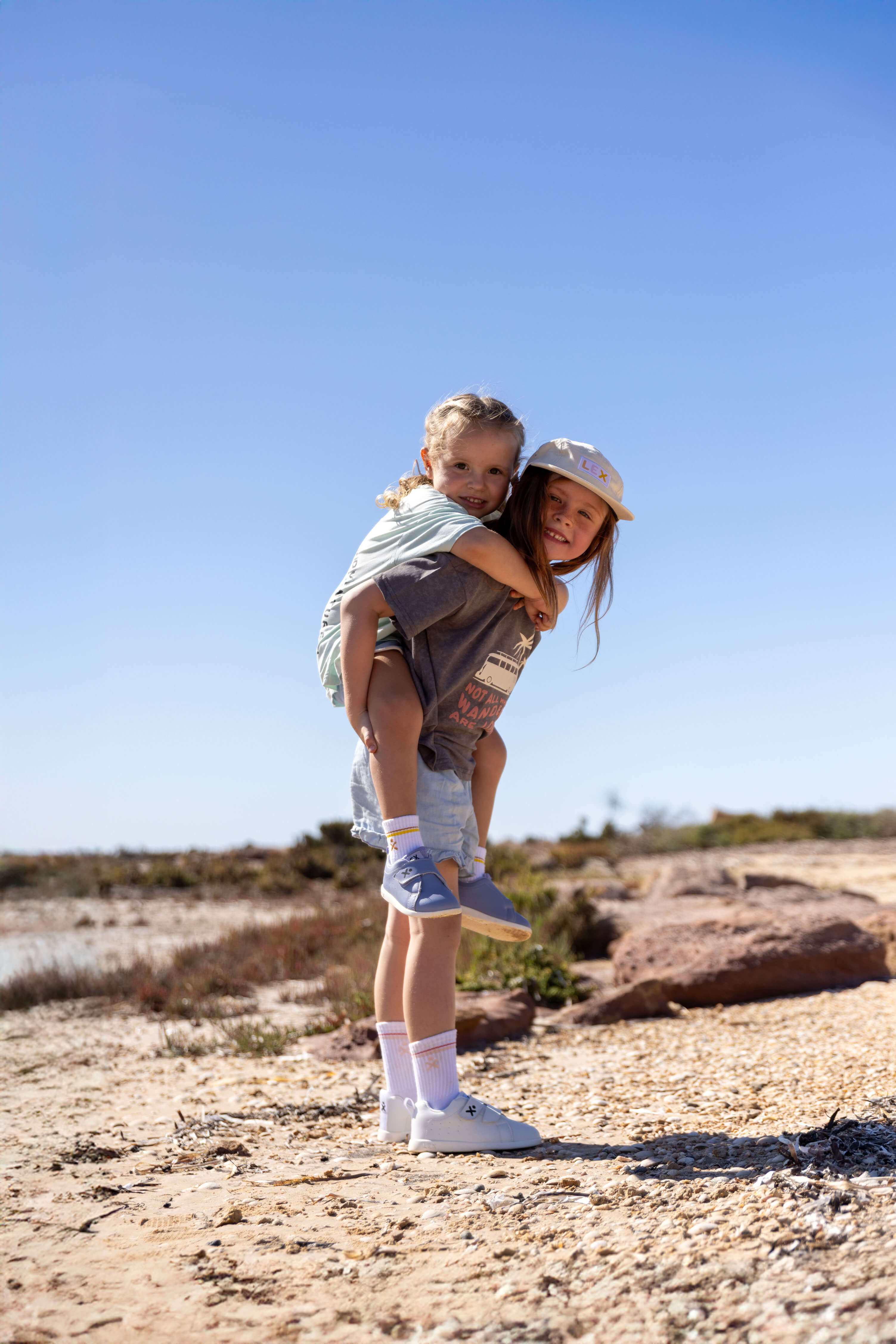 Kid-piggyback-purpleshoe.jpg